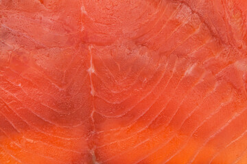 thin slices of Smoked salmon macro food background