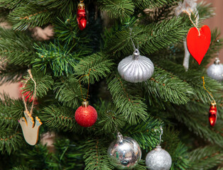 Toys on the branches of an artificial tree.
