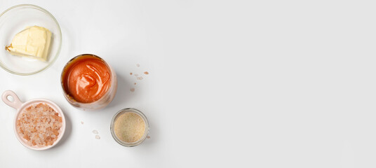 Homemade salted caramel in a glass jar. Delicious sauce with sea salt for ice cream and dessert
