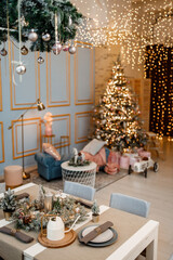 Modern design Christmas tree decorated with balls, toys and garlands. Christmas or New Year background. Winter holidays composition.