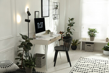 Stylish room interior with comfortable workplace. Home office