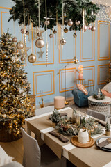 Modern design Christmas tree decorated with balls, toys and garlands. Christmas or New Year background. Winter holidays composition.