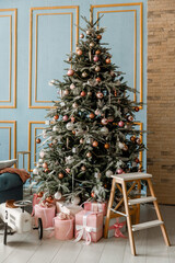 Modern design Christmas tree decorated with balls, toys and garlands. Christmas or New Year background. Winter holidays composition.