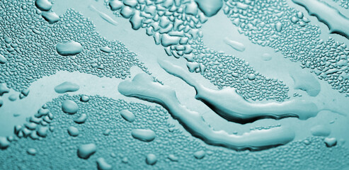 Macro background with water droplets condensation pattern on metal surface 
