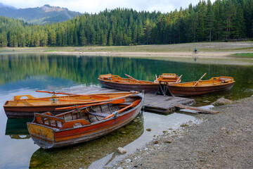 Boats in the water. Black Lake or Crno Jezero. National park Durmitor Mouintains in Montenegro.
