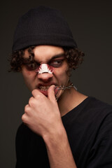 a fighter with a broken nose aggression conflict the dark background