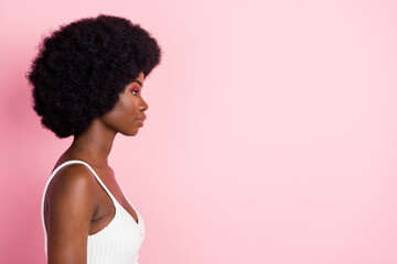 Profile photo of serious millennial wavy hairdo lady look empty space wear white top isolated on...