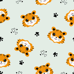 Fototapeta premium Cute cartoon tiger cub seamless pattern. Funny tiger and his footprints on a gray background. Scandinavian design of the children's room. A template for cute pajamas with animals. Vector illustration 