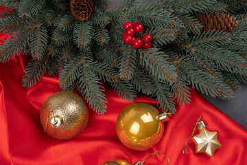 Sparkling Christmas decorative toys create round frame on red background. Flat lay style. Festive concept