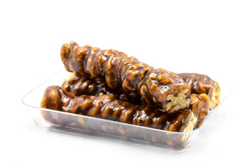 Packed sausage walnuts on a white background. Turkish walnut raisin sausage sweet