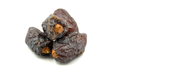 Date fruits on the white background. Fresh Medjool Dates for ramadan. Empty space for text. Copy space