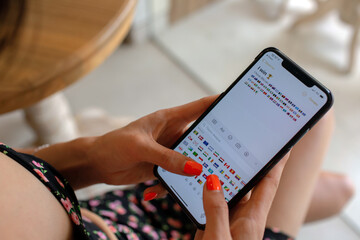 woman typing a message to her friends