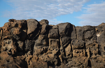 Porous lava volcanic rock around around Playa de la Concha beach in El Cotillo La Oliva...