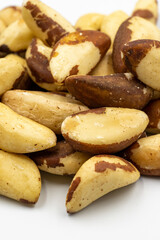 Brazil nut isolated on white background. Snack nuts. Close-up. Story format