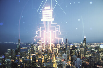 Virtual creative light bulb with chip hologram on Chicago office buildings background, artificial Intelligence and neural networks concept. Multiexposure