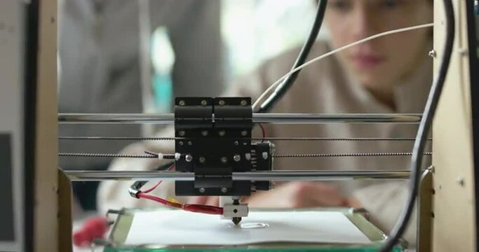 Students printing a prototype using a 3D printer