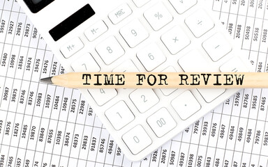 text TIME FOR REVIEW on the wooden pencil on calculator with chart