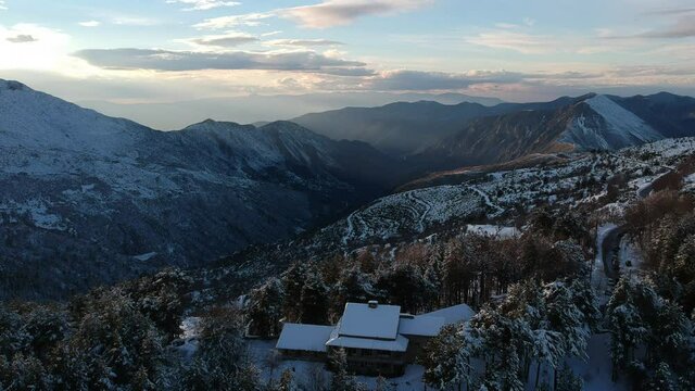 Aerial view of the snowy mountain Taygetus (also known as Taugetus or Taygetos) above Messenia unit in Peloponnese, Greece. Amazing natural scenery of the highest mountain in Peloponnese during winter