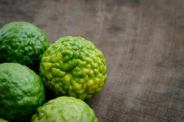 bergamots on dark wood with copy space