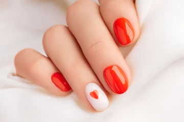  Close up manicured womans hand. Fashionable valentines day nail design © Darya Lavinskaya