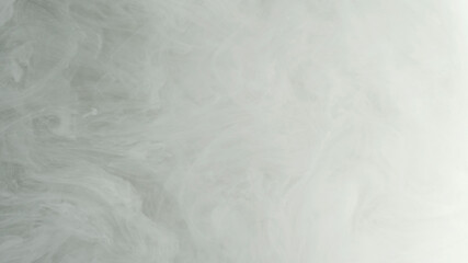 White cloud of ink, white smoke. White ink in water on a black background. Environmental pollution...