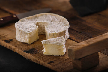 Fototapeta na wymiar Soft french cheese on wooden background