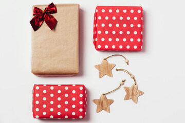 Obraz premium Christmas composition. Gifts, christmas wooden stars. Layout for the holiday. Top view, flat lay