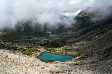view from Passo Bornengo with a mountain lake in Val Maighels, Surselva