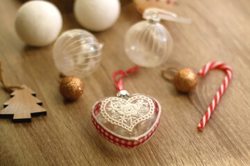 Various Christmas ornaments, candles and colorful bokeh lights. Selective focus.