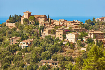 Fototapeta na wymiar Traditional stone houses and tramuntana mountains in Deia. Balearic islands