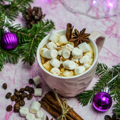 Obraz na płótnie Canvas Hot chocolate with marshmallows, a warm cozy Christmas drink on a gray background. Christmas hot chocolate with marshmallows. festive decor.