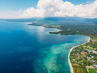 Fototapeta na wymiar Tropical ocean coast with sandy beach and turquoise ocean, aerial drone view.