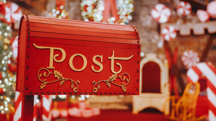 Closeup Red post box for letters to Lapland to Santa Claus. Christmas tradition. Decorative mailbox...
