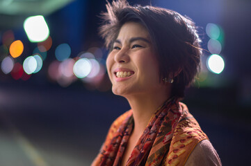 asian short hair lady smile near the street at night