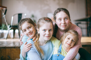 Four girlfriends on  couch at home.