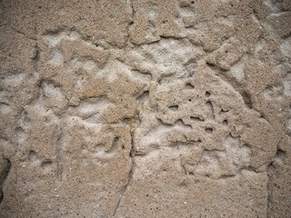 textura de una pared de cemento desgastada y golpeada
