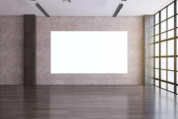 Modern spacious empty office interior with shiny wooden flooring, empty mock up poster on brick wall and window with city view and daylight. 3D Rendering.