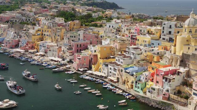 Procida, Marina Corricella, Italy. Landscape, boats, sea, Italian, island, colors, houses, summer, panorama, beautiful, port, marina / 4K Video Footage
