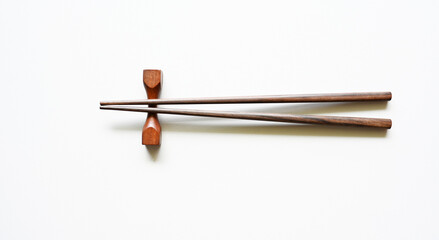 wood Chopsticks for sushi on White background Copy space