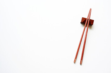 wood Chopsticks for sushi on White background Copy space