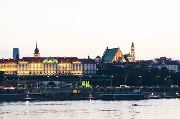 Fototapeta premium POLAND, WARSAW: Evening scenic cityscape view of city old center with Vistula river 
