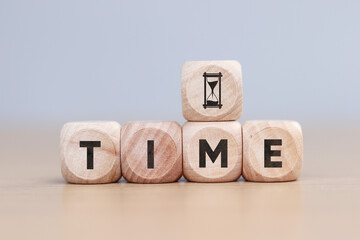 Wooden cube with Time text. Business concept.