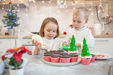 Brother and sister making cupcakes