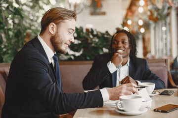 Two internatioal businessmen at the restaurant