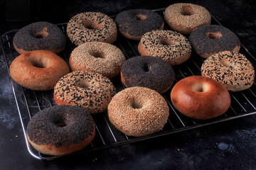 Homemade Bagels. Fresh bagels with sesame and poppy seeds. Variety of assorted New York style Bagels. 