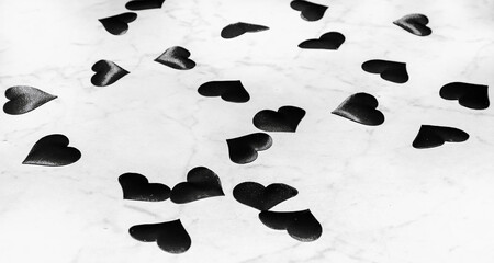 Black hearts on a white background for congratulations on the holidays to your loved. Place for text 