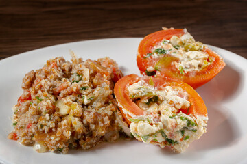 Tabbouleh Salad with stuffed tomato. Vegetarian food. Traditional middle eastern or Arab dish. Top view
