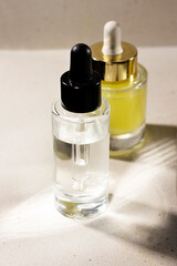 elegant cosmetic bottles with a transparent serum and one