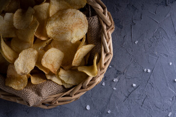 natural potato chips on a gray concrete background