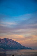 Fototapeta na wymiar Pink mountain at sunrise ligths in Budva, Montenegro 
